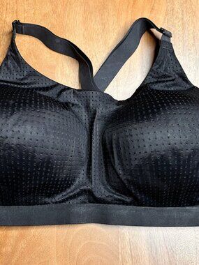 Victoria Secret black mesh molded-cup sports bra featuring a supportive cross-ba